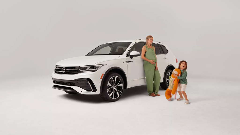 Family standing in front of a 2024 VW Tiguan