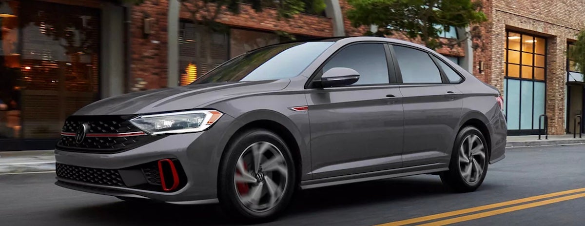 grey 2023 Jetta GLI driving